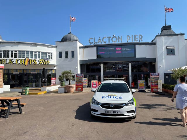 A police car at Clacton Pier in Clacton-on-Sea, Essex, as a swimmer is missing at sea (Sam Russell/PA)