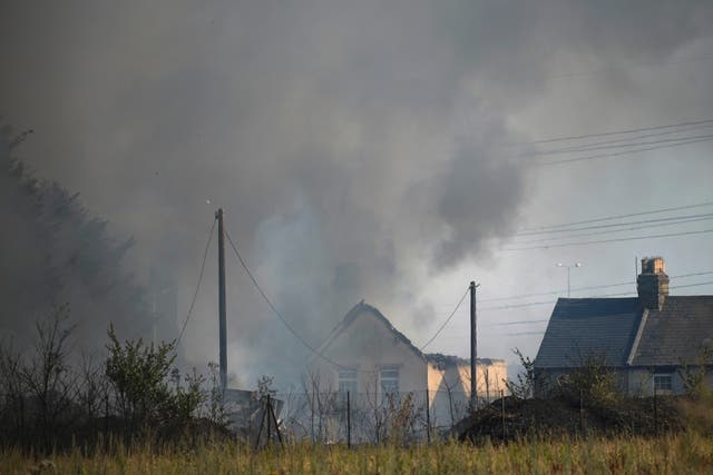 The major a blaze in the village of Wennington, east London. (Yui Mok/PA)