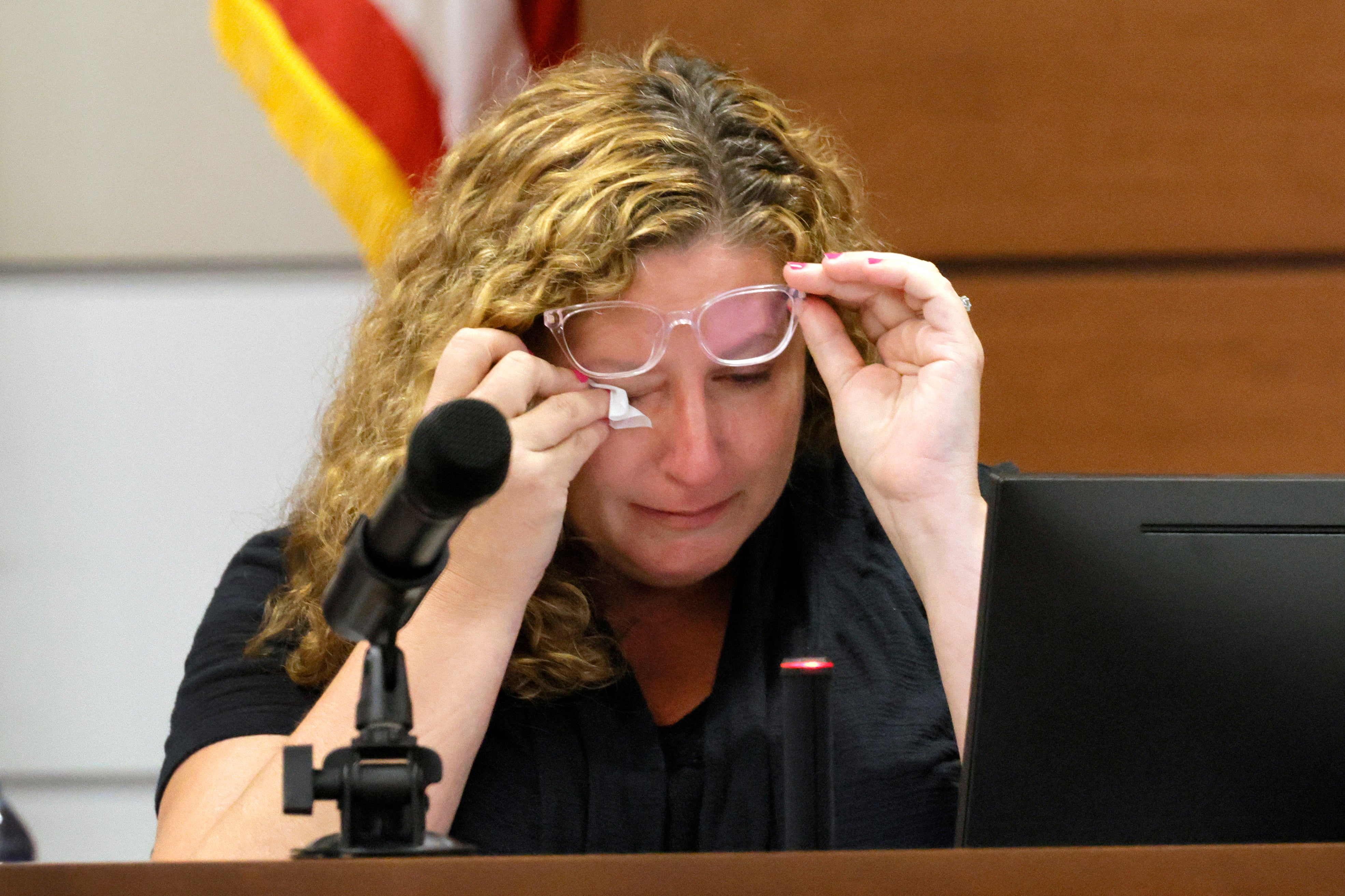 Marjory Stoneman Douglas High School teacher Dara Hass wipes away tears as she testifies