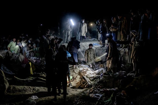 <p>Taliban fighters look for drug addicts hiding in garbage to detain and move them to a drug treatment camp in Kabul</p>