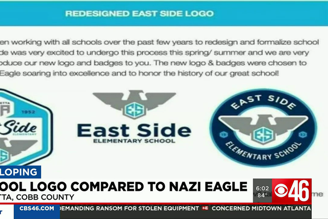<p>The logo of the East Side Elementary School depicts an eagle over the school’s initials </p>