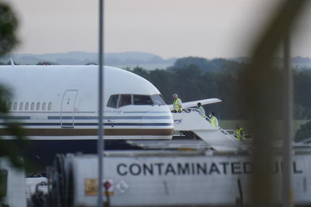 <p>A plane at MoD Boscombe Down which had been due to take asylum seekers to Rwanda before the flight was halted (Andrew Matthews/PA)</p>