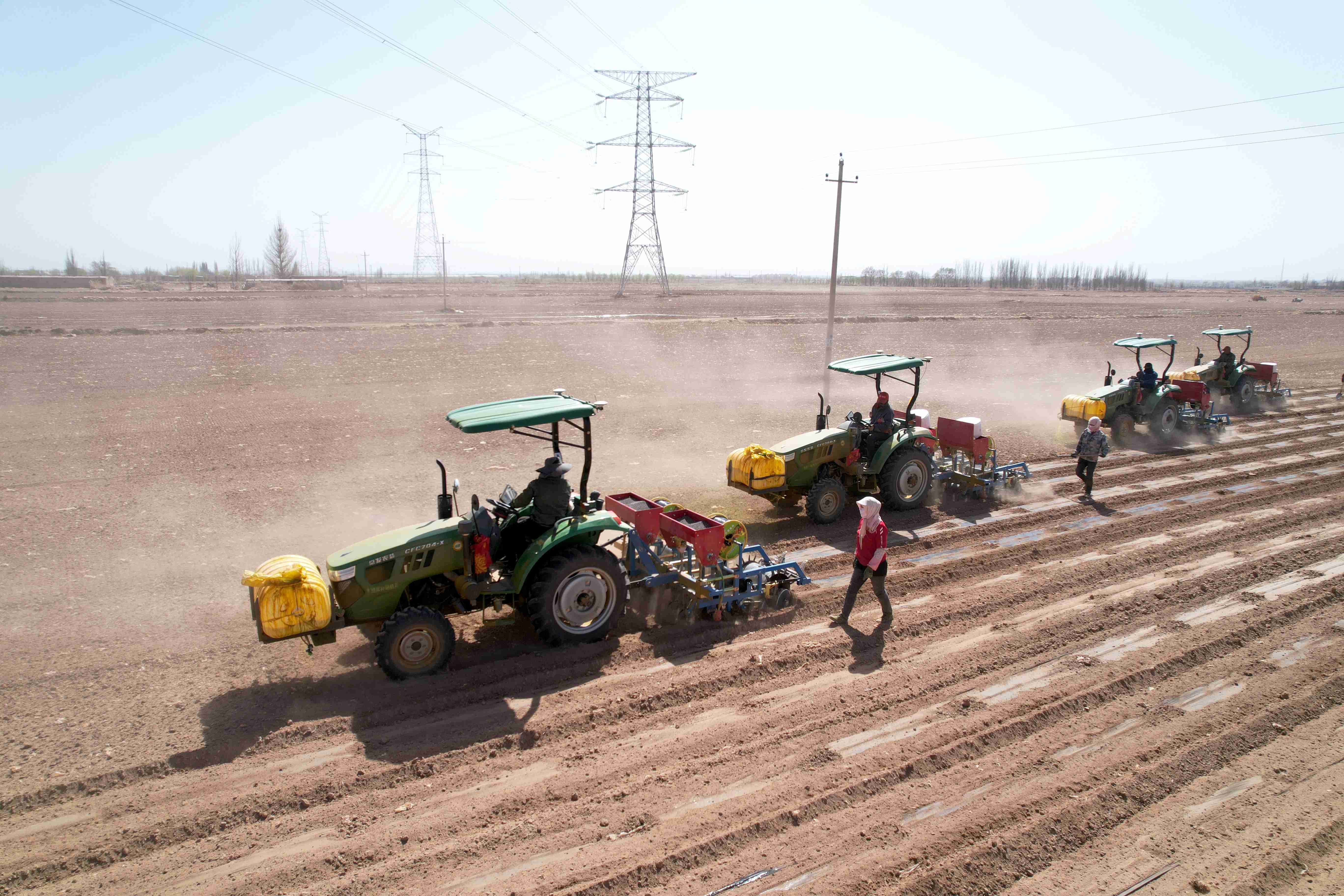 Tractors connected with the Beidou Navigation Satellite System conduct spring ploughing in Zhangye, Gansu province, in April, 2022