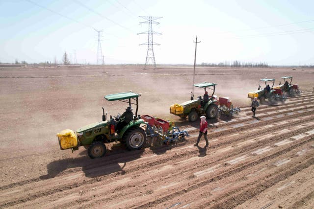 <p>Tractors connected with the Beidou Navigation Satellite System conduct spring ploughing in Zhangye, Gansu province, in April, 2022   </p>