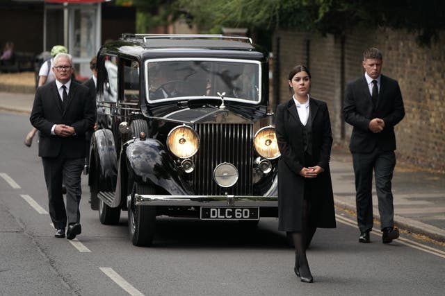 The hearse and cortege arriving for the funeral service of Dame Deborah James at St Mary’s Church in Barnes, west London (Aaron Chown/PA)