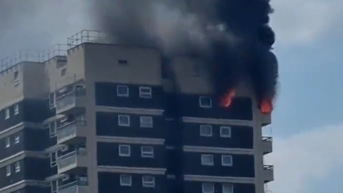 Fire and smoke billows from multi-storey flat in Woolwich