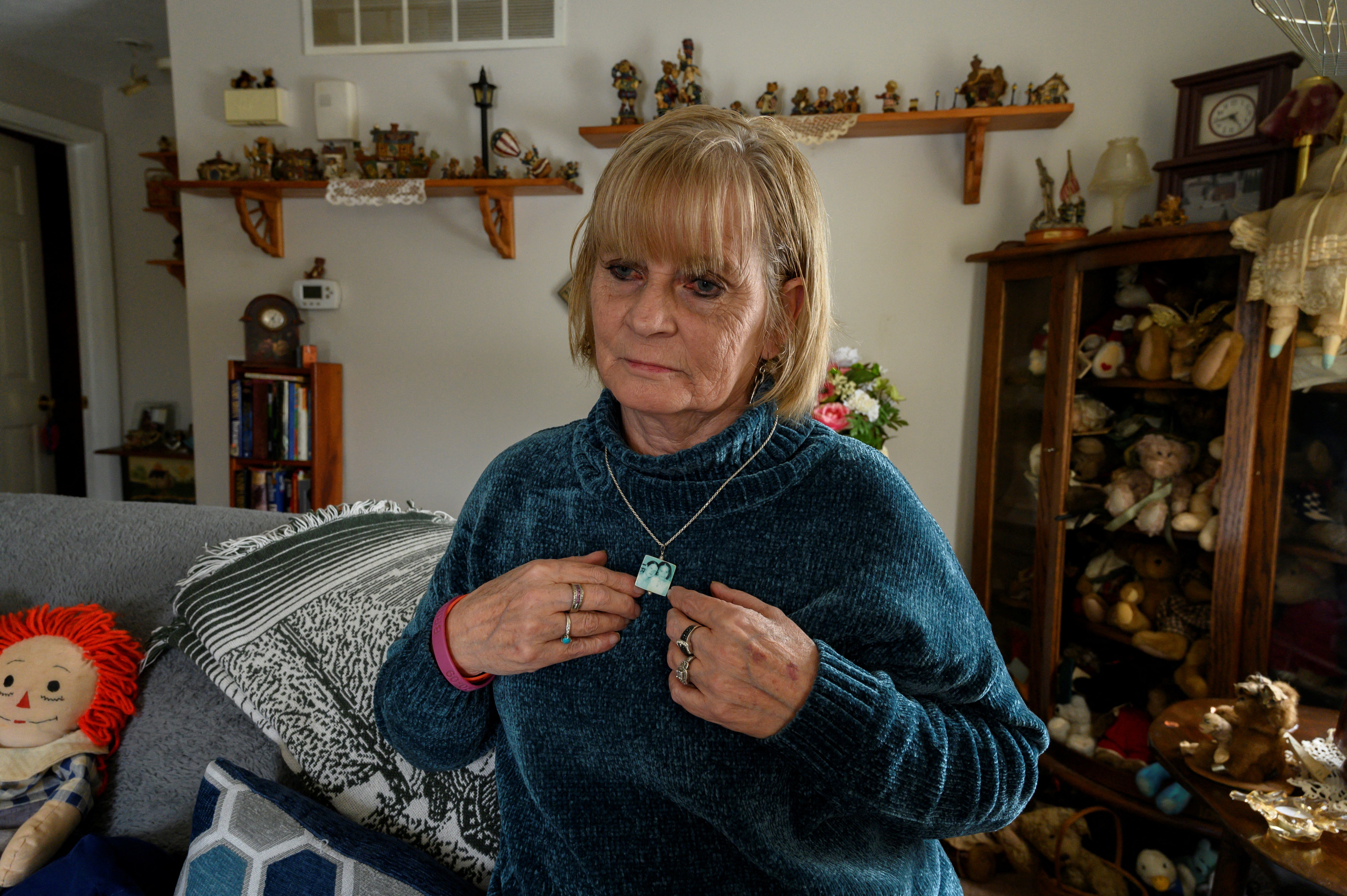 Dale Cook Driscoll shows a necklace with a photo of her daughter Helen Buchel and granddaughter Brittany Passalacqua