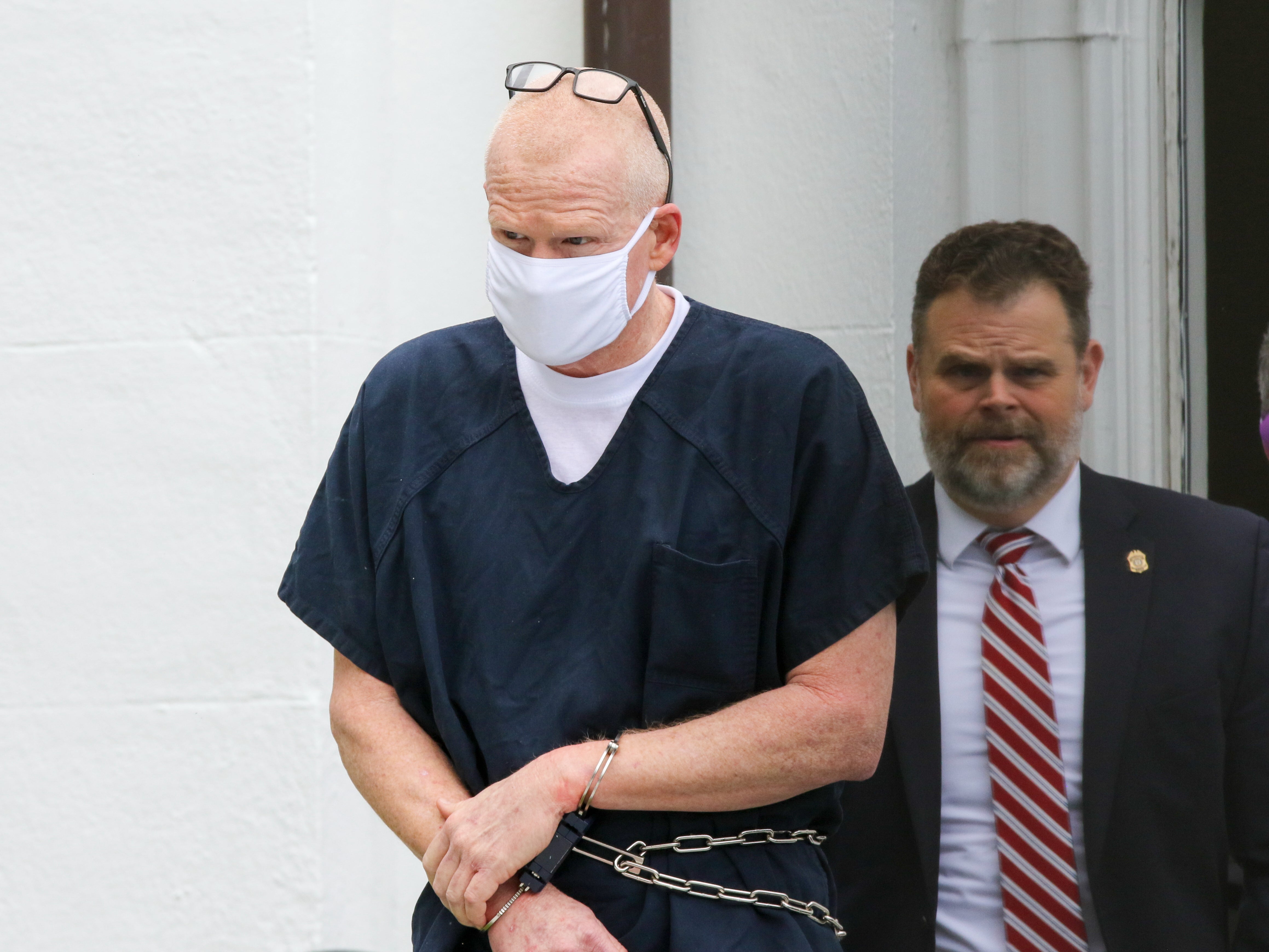 Alex Murdaugh is escorted out of the Colleton County Courthouse in Walterboro, South Carolina, on Wednesday 20 July 2022