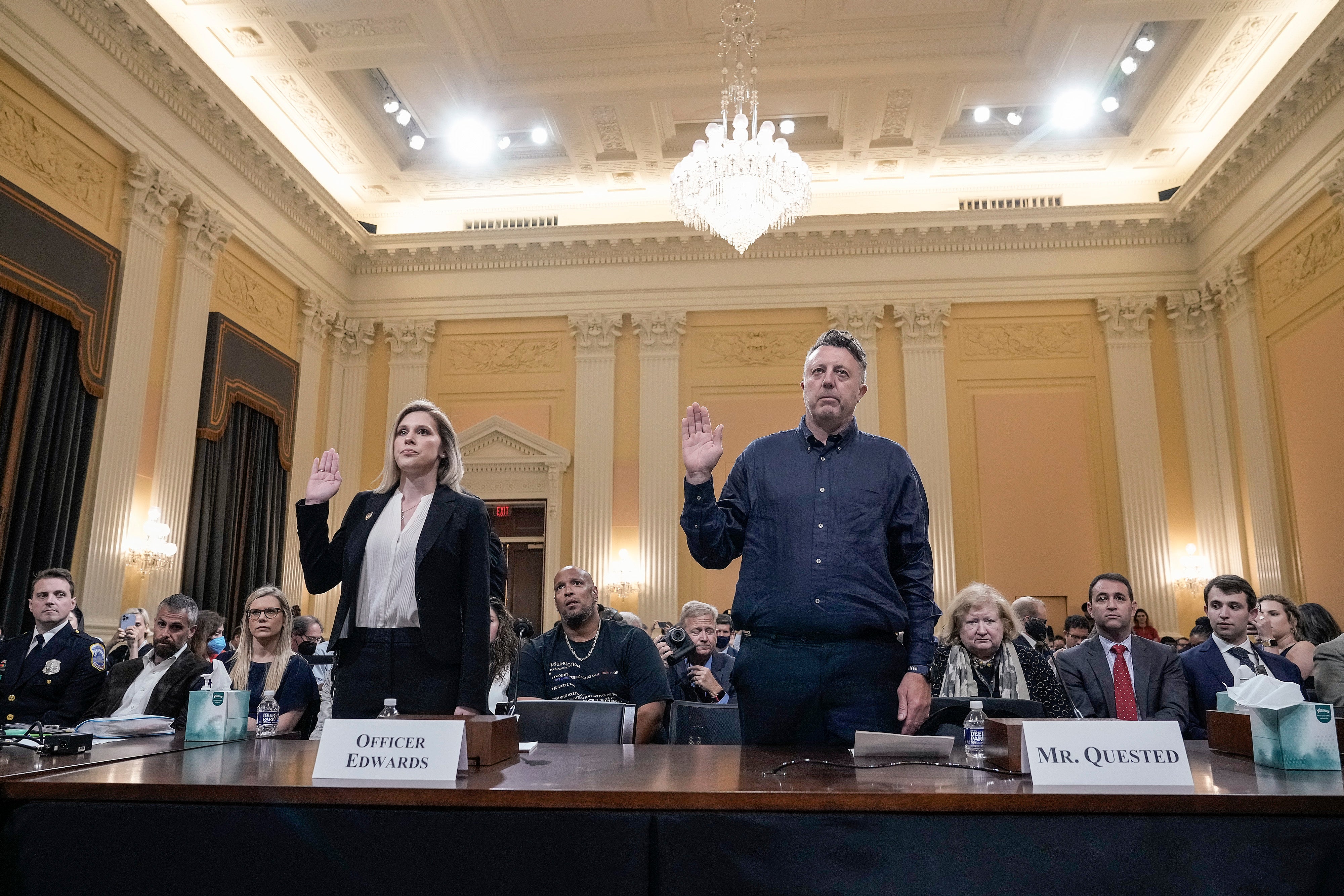 U.S. Capitol Police Officer Caroline Edwards and Nick Quested, a documentary filmmaker who was embedded with the Proud Boys, a far-right militia group, are sworn-in during a hearing