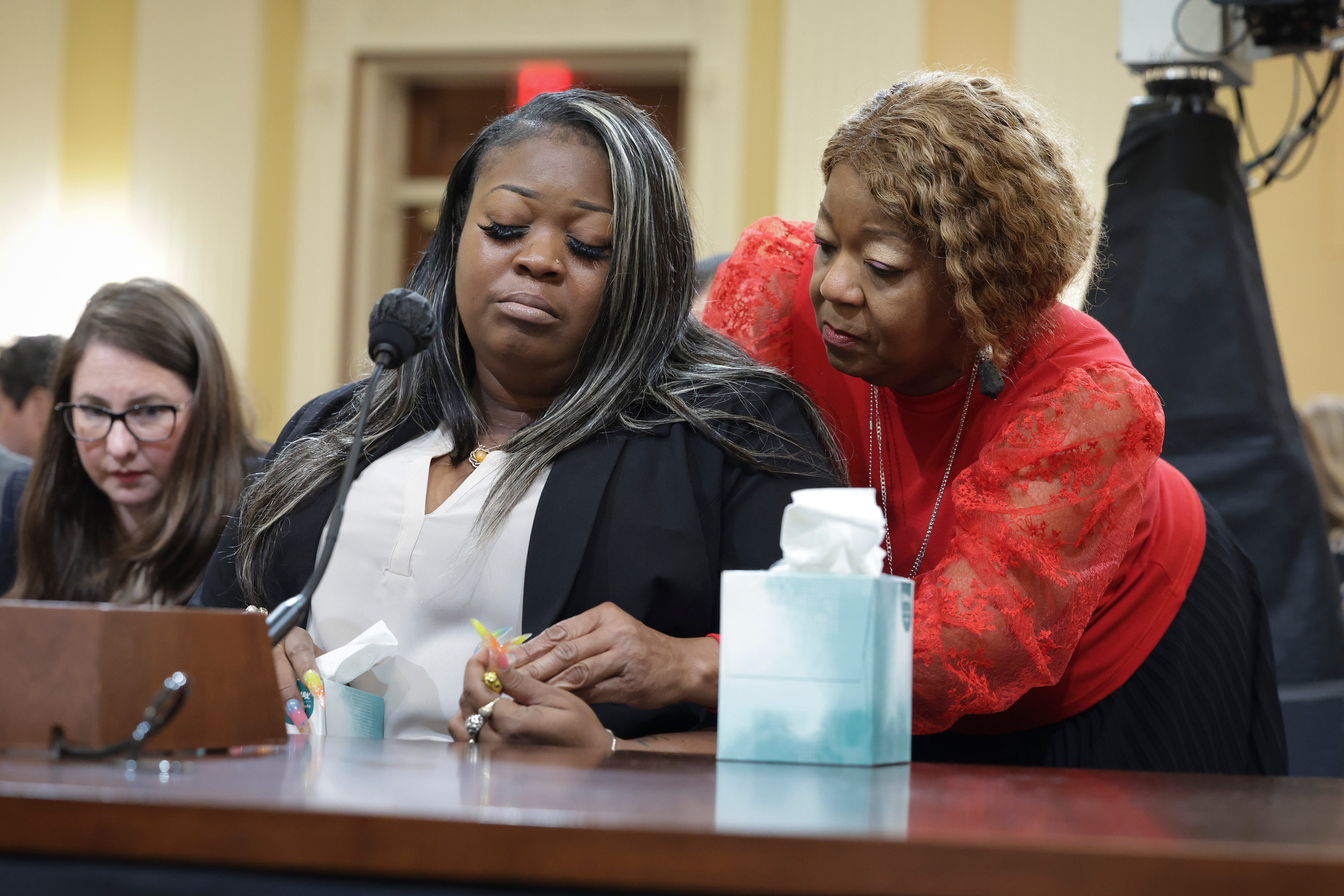 Shaye Moss is comforted by her mother Ruby Freeman as Moss testifies during the fourth hearing on the January 6th investigation