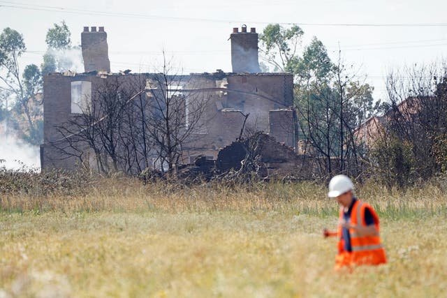 The scene after a blaze in the village of Wennington (PA)