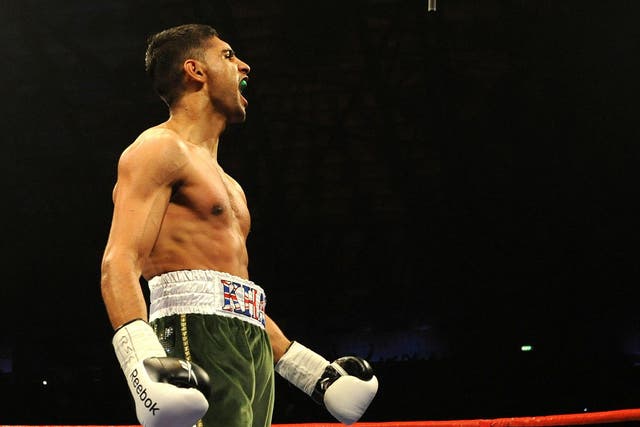 Amir Khan had his watch stolen after he was allegedly threatened with a firearm (PA)