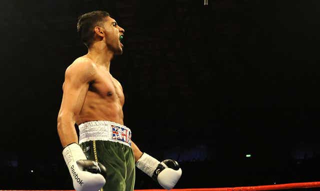 Amir Khan had his watch stolen after he was allegedly threatened with a firearm (PA)
