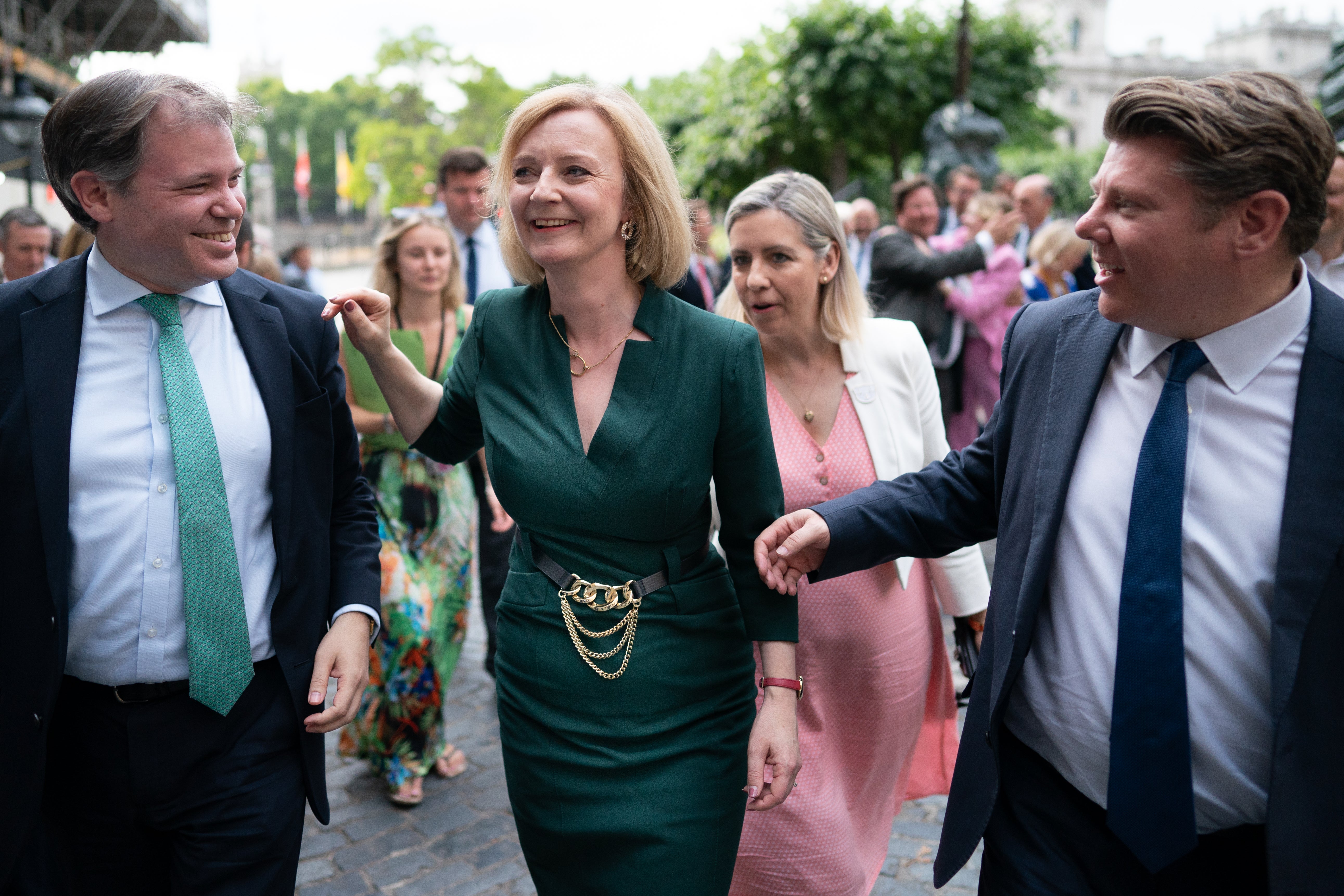 Liz Truss celebrates with her supporters after making it into the final stage of the race to Number 10 (Stefan Rousseau/PA)
