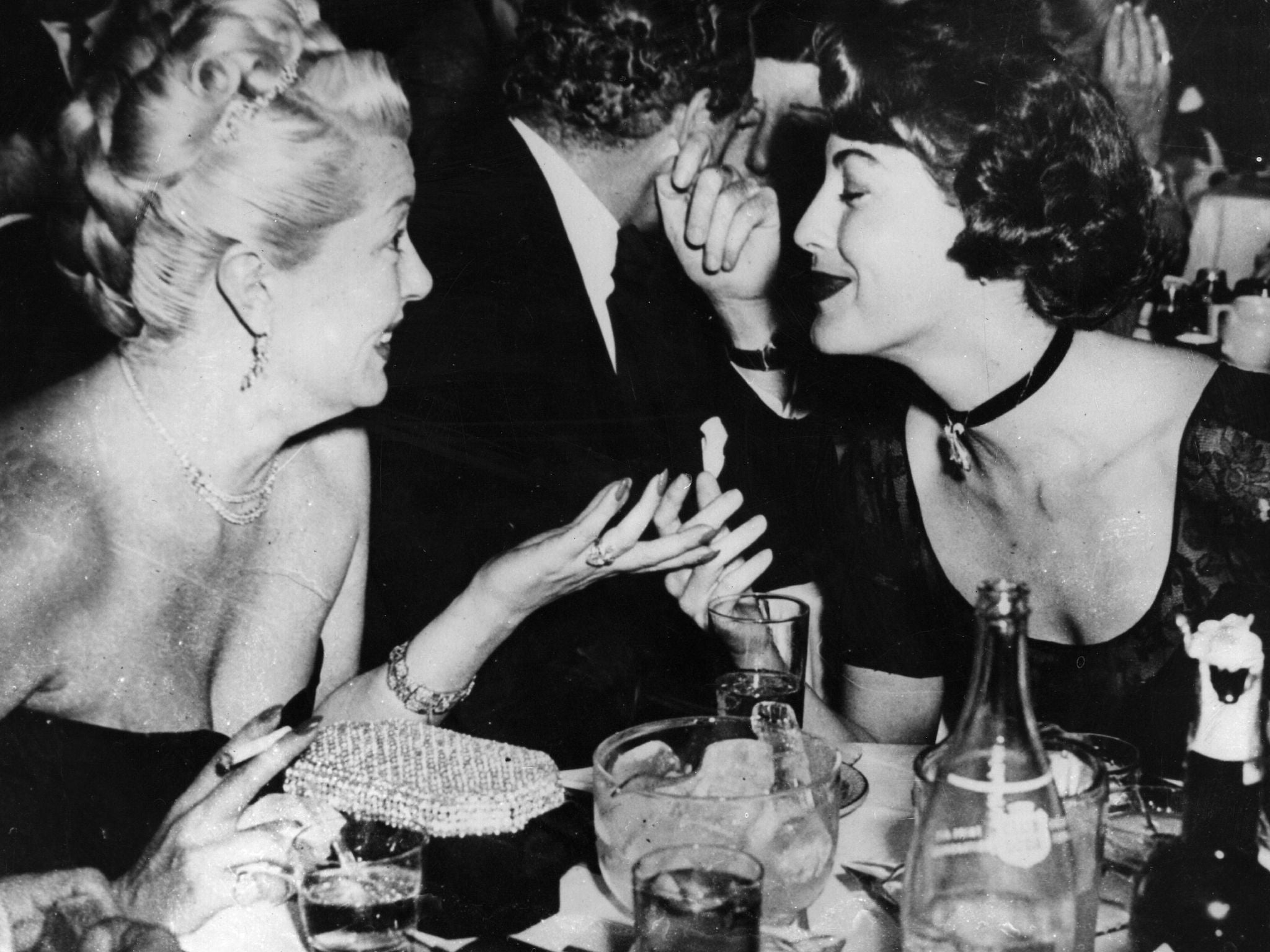 Lana Turner and Ava Gardner dining in a Hollywood restaurant