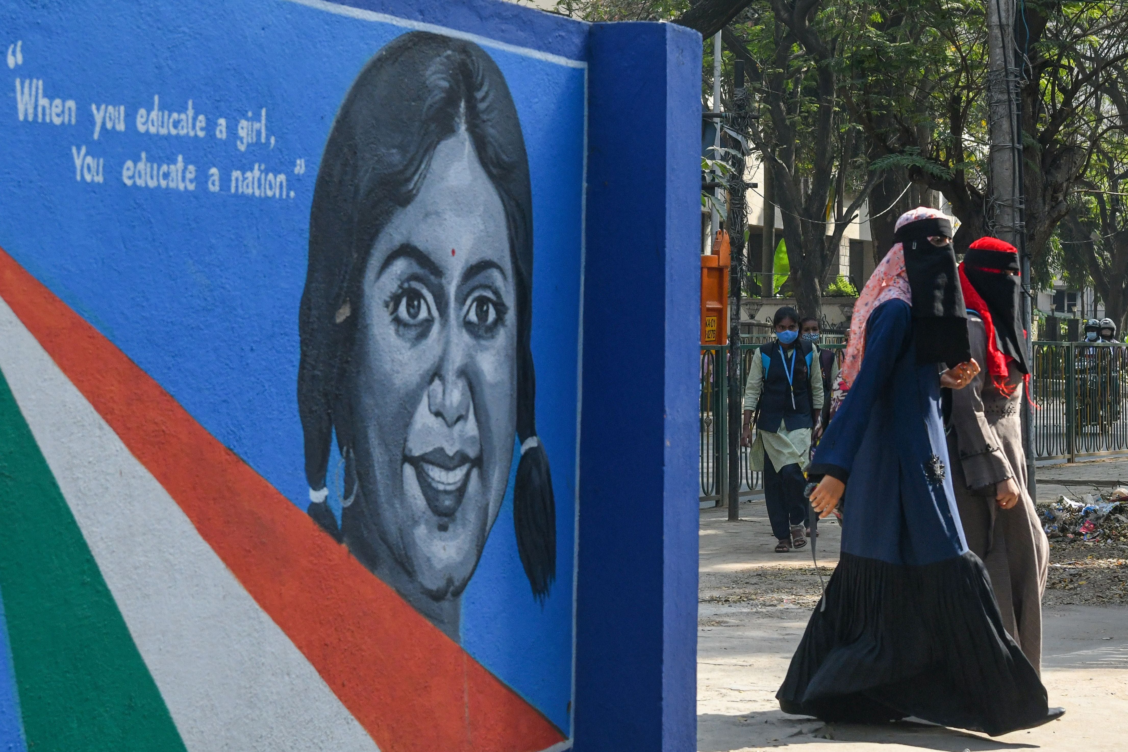 Students enter a government high school and pre-university college for women in Bangalore