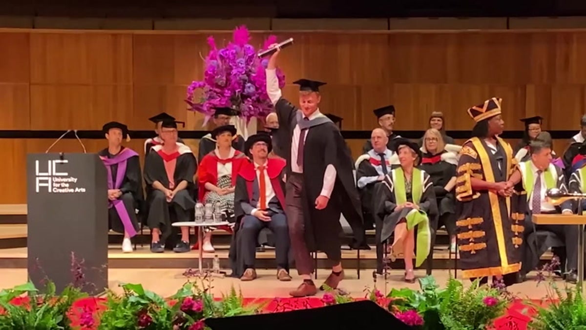 Graduate takes Banksy’s honorary degree after artist fails to show up at ceremony