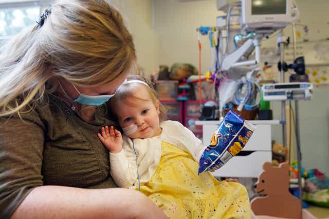 Cheryl Adamson with her 18-month-old daughter Beatrix Adamson-Archbold at the Freeman Hospital in High Heaton, Newcastle Upon Tyne (Owen Humphreys/PA)
