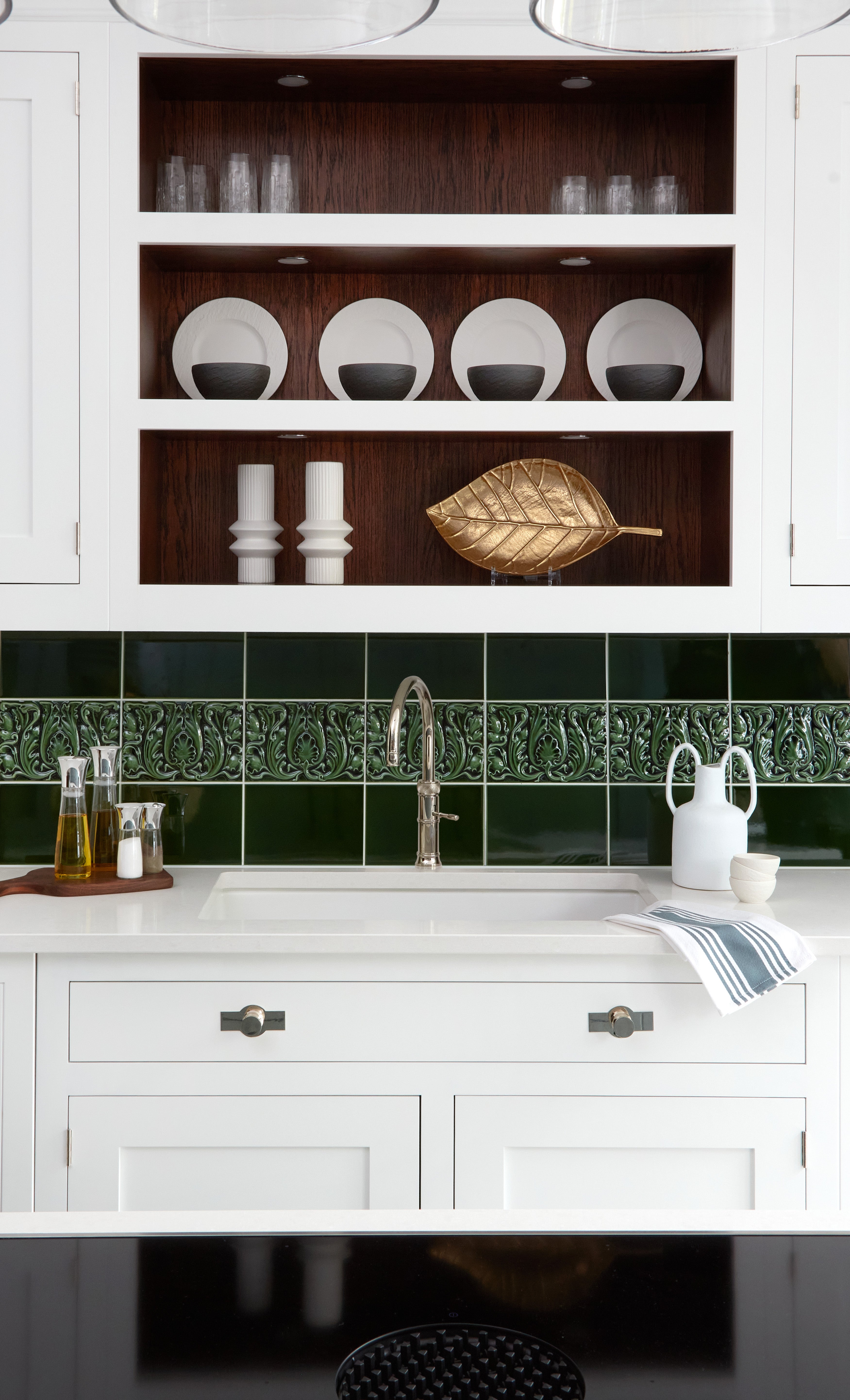 The colour of your cabinets and even the shade of your worktops can be elevated with the right kind of tiles