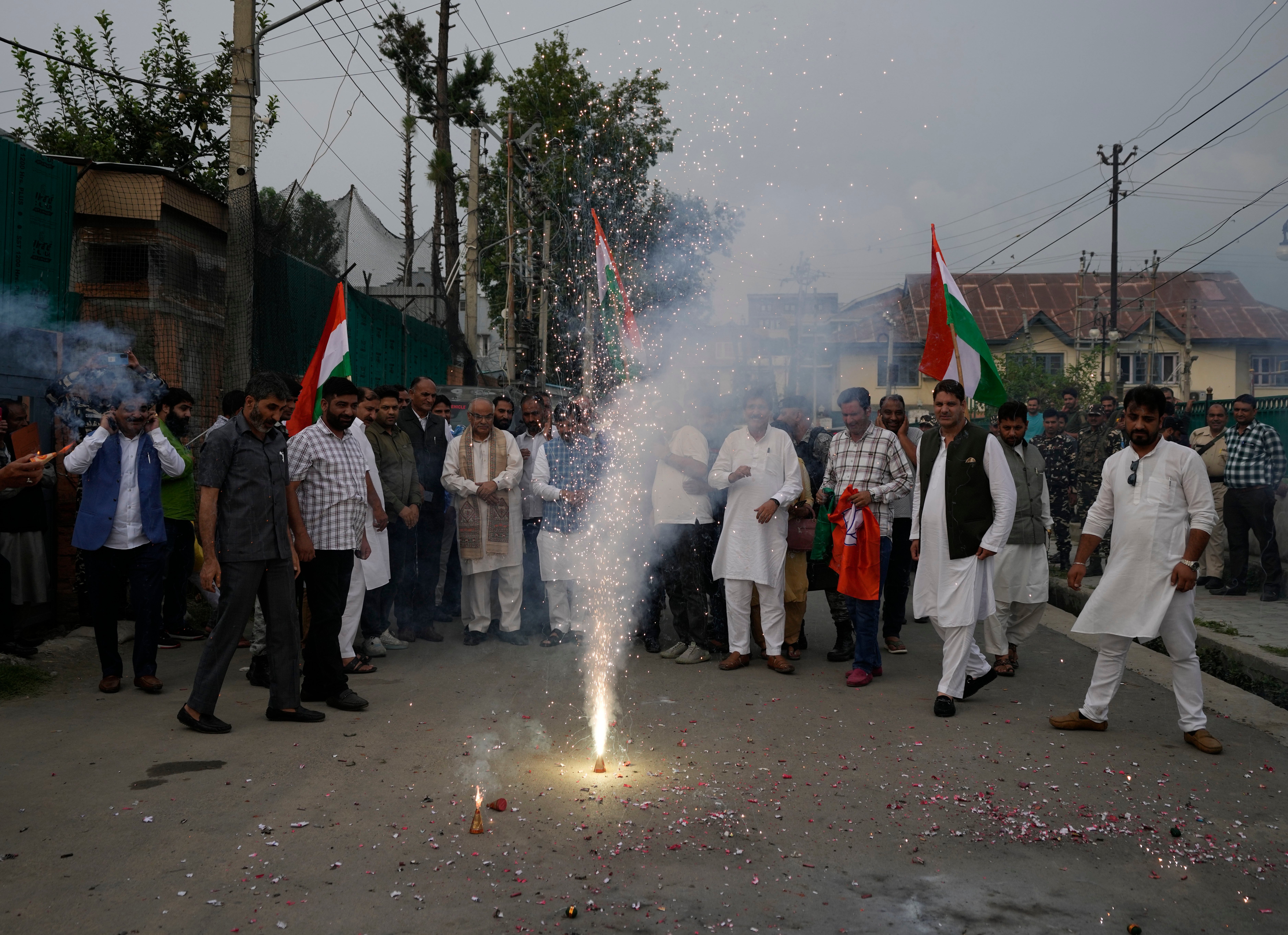 Bharatiya Janata Party (BJP) workers light firecrackers in Srinagar, Indian controlled Kashmir