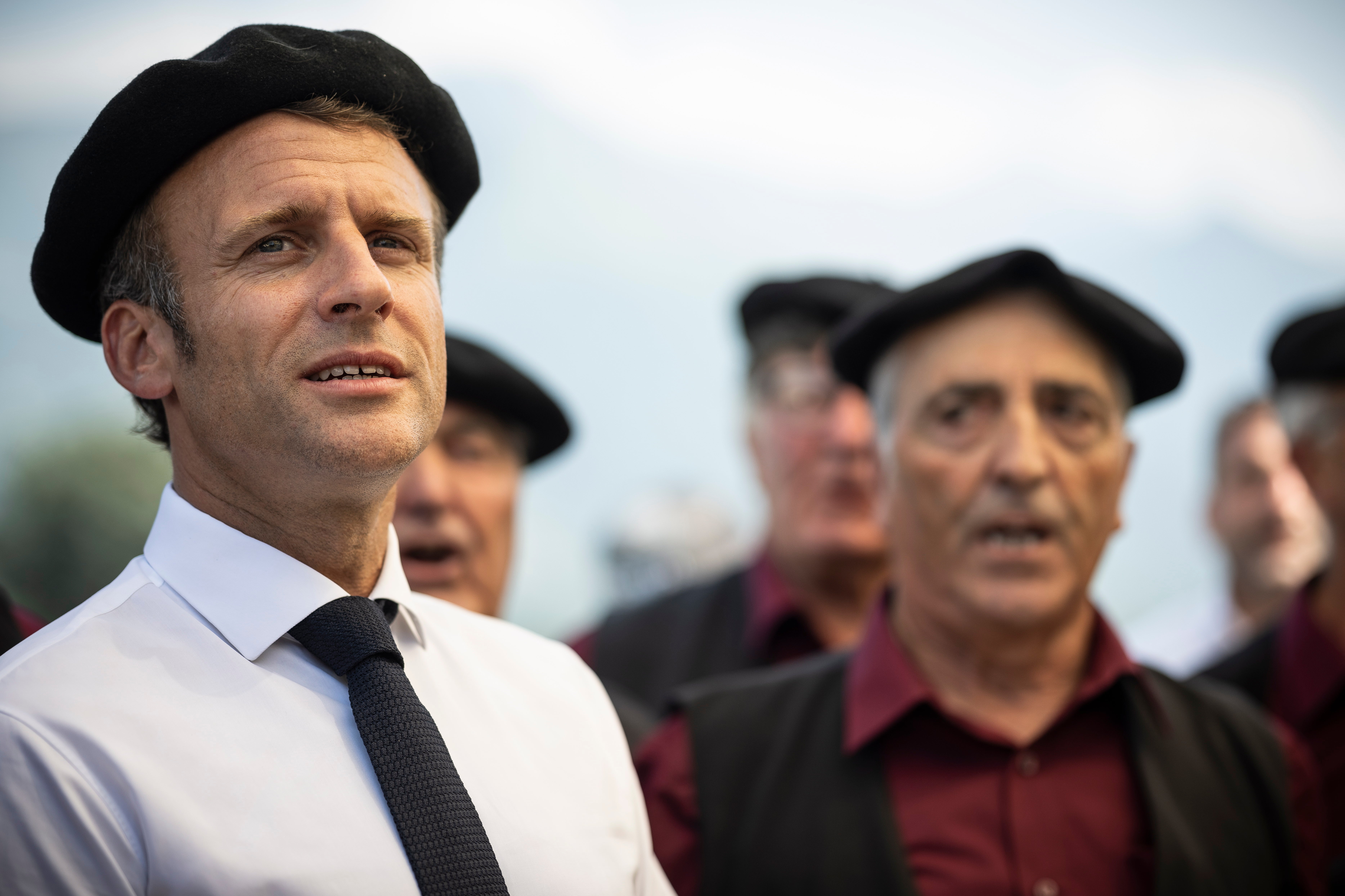 French President Emmanuel Macron sings during a visit to Argeles-Gazost, southern France
