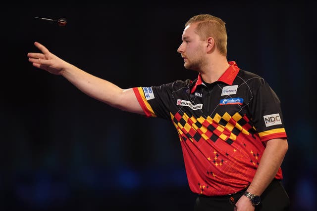 Dimitri Van Den Bergh knocked out reigning champion Peter Wright to win a classic at the World Matchplay in Blackpool (Adam Davy/PA)