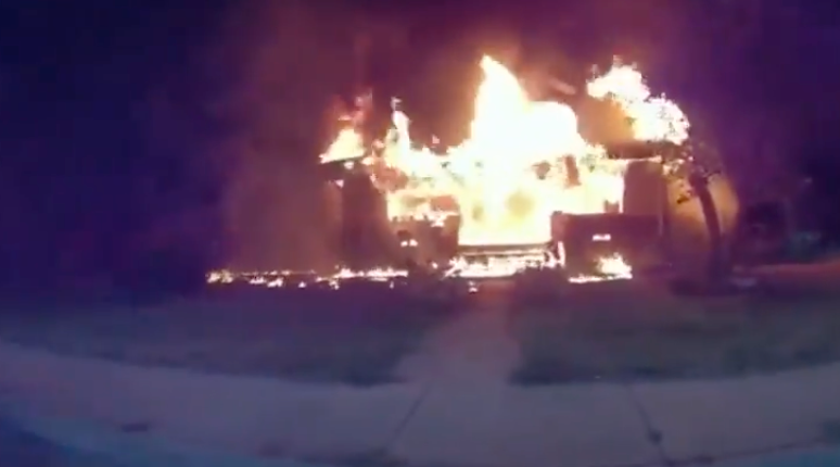 Police body camera footage of a house on fire in Lafayette, Indiana, on 11 July, 2022.