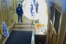 New footage shows Josh Hawley running away from pro-Trump protesters hours after raising fist in solidarity to them