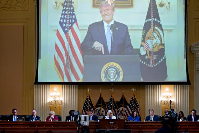 <p>A video of President Donald Trump recording a statement on Jan. 7, 2021, is played, as the House select committee investigating the Jan. 6 attack on the U.S. Capitol holds a hearing at the Capitol in Washington, Thursday, July 21, 2022</p>