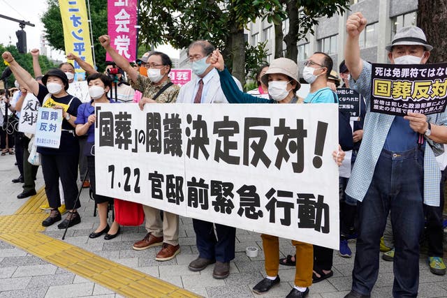 <p>File. Protesters hold a rally against the cabinet decision to hold a state funeral for the assassinated former Prime Minister Shinzo Abe, in front of the prime minister's office in Tokyo Friday, July 22, 2022. Japan's Cabinet formally decided to hold a state funeral on Sept. 27 for Abe. The banner reads “Against the cabinet decision to hold a state funeral” </p>