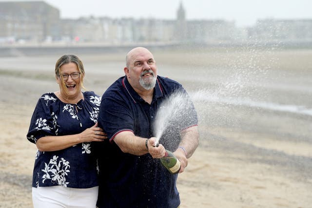 Helen and Lee Kuchczynski, from Cumbria, celebrate their ?3.6 million EuroMillions win (Danny Lawson/PA)