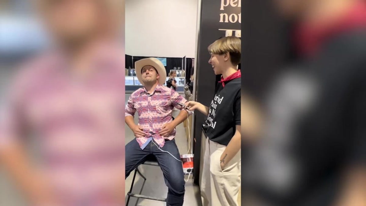 Cowboy writhes in pain from period simulator, woman doesn't flinch