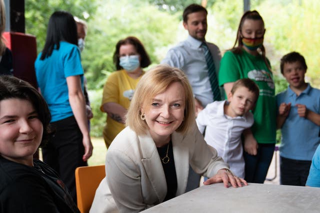 Foreign Secretary and Tory leadership candidate Liz Truss meeting staff and children during a visit to the children’s charity, Little Miracles in Peterborough, to speak about the cost-of-living pressures and her vision to ease the burden on families. (Stefan Rousseau/PA)