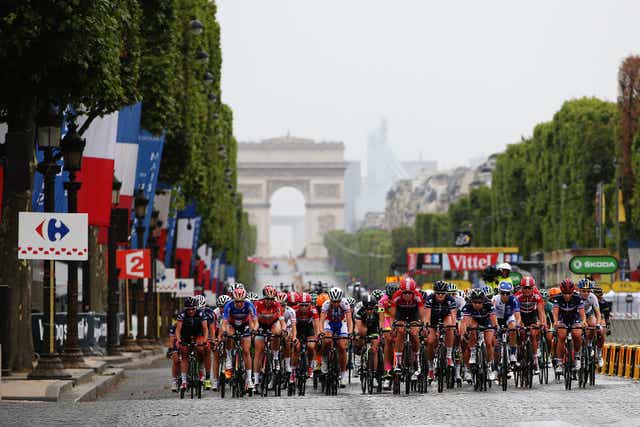 <p>La Course riding up the Champs-Elysees in 2015</p>