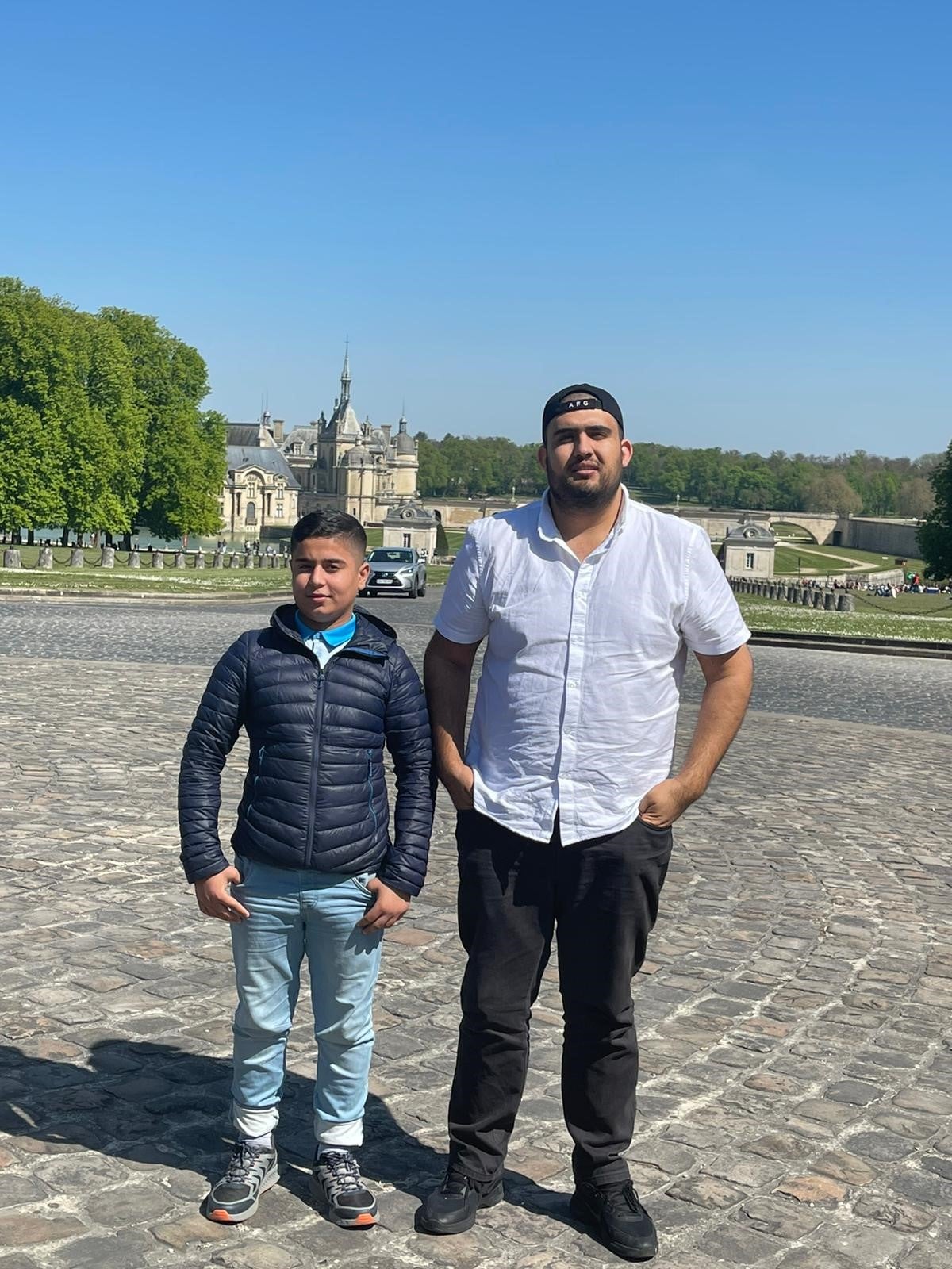 Qamar Jabarkhyl, right, on a visit to see his cousin Obaidullah who is stranded in France
