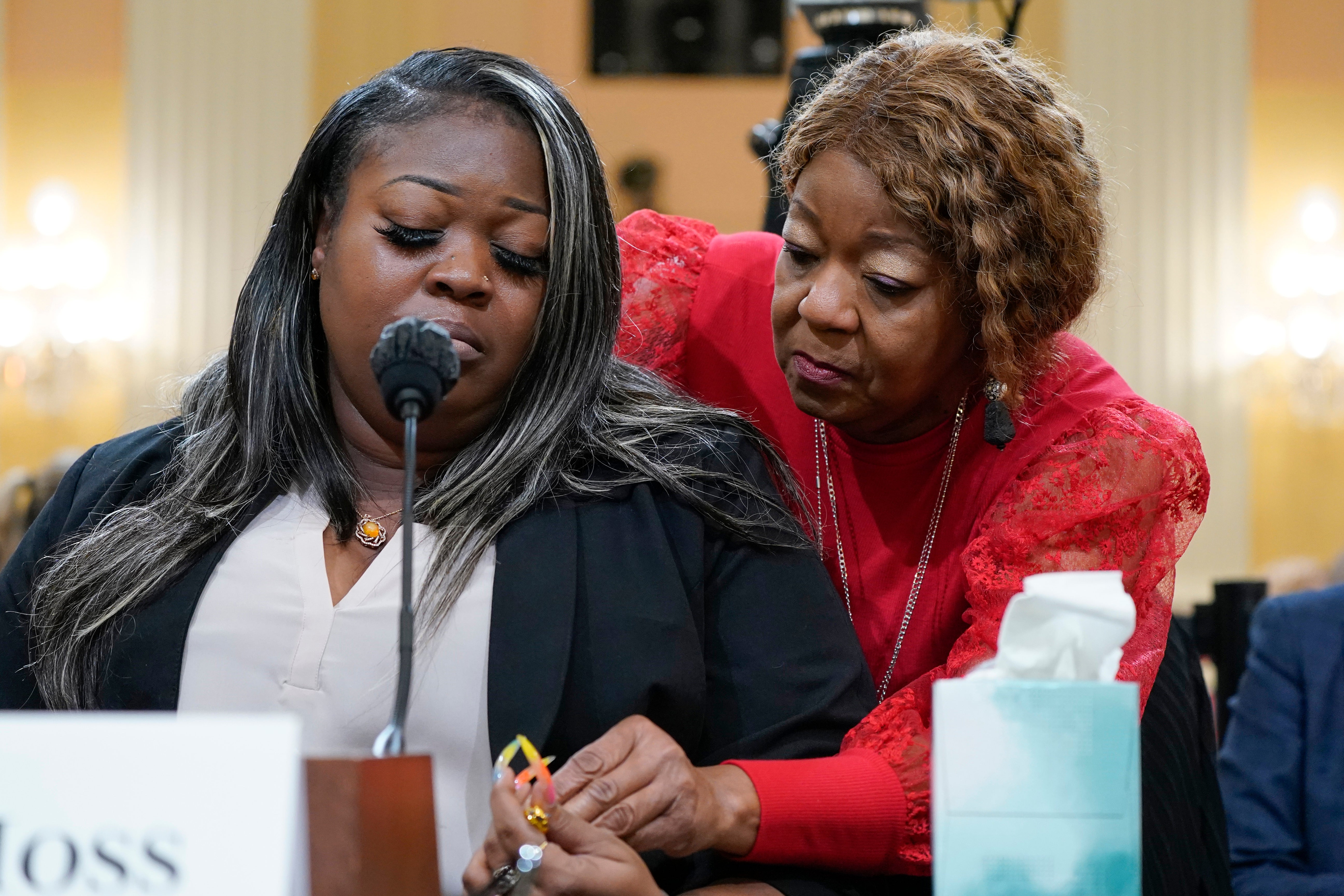Wandrea ‘Shaye’ Moss, a former Georgia election worker, is comforted by her mother, Ruby Freeman, right, as the House select committee investigating the Jan. 6 attack on the U.S. Capitol holds a hearing at the Capitol in Washington, June 21, 2022