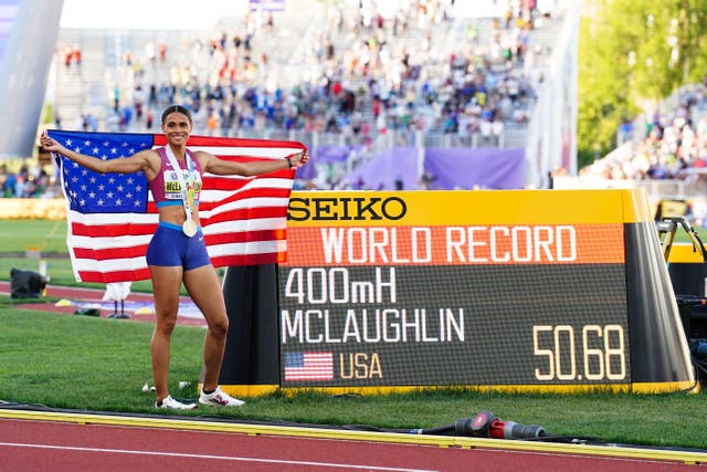 The USA’s Sydney McLaughlin celebrates gold and a new world record. (Martin Rickett/PA)