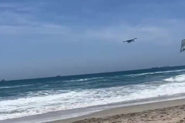 <p>Beachgoers panic as plane crashes into ocean in Huntington Beach</p>