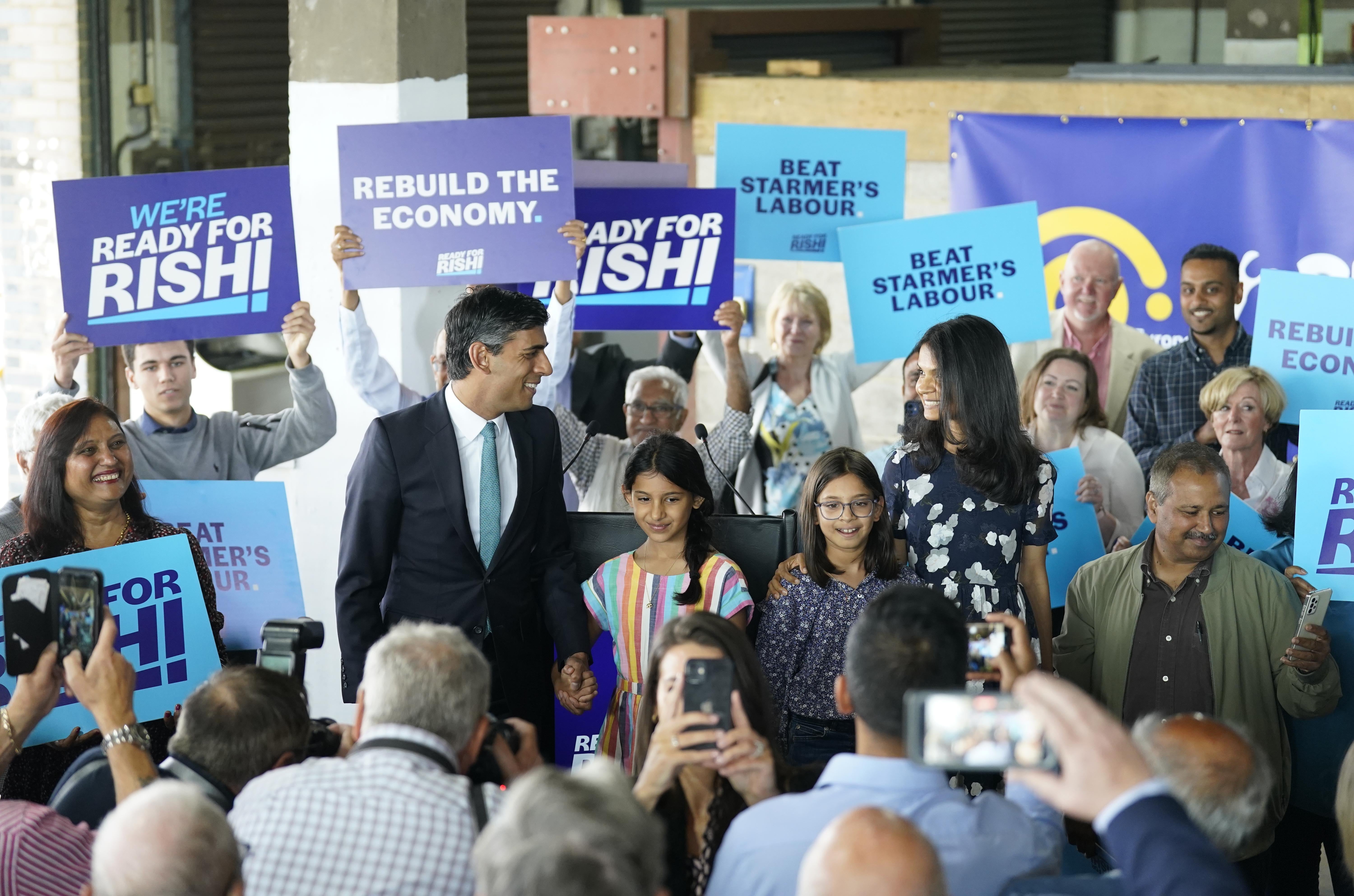 Rishi Sunak, with daughters Krishna, Anushka and wife Akshata Murthy (Danny Lawson/PA)