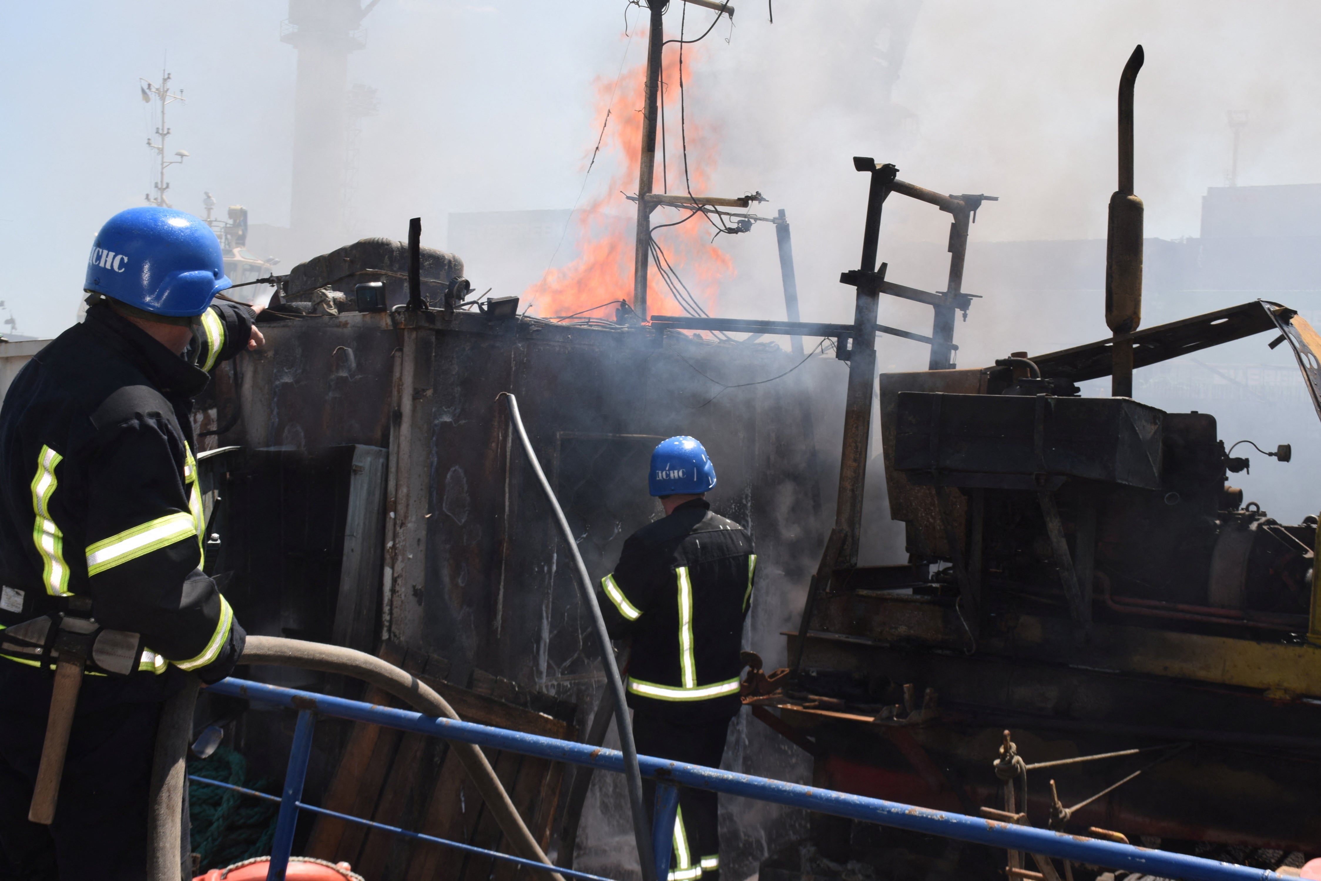 Firefighters work at a site of a Russian missile strike in Odesa