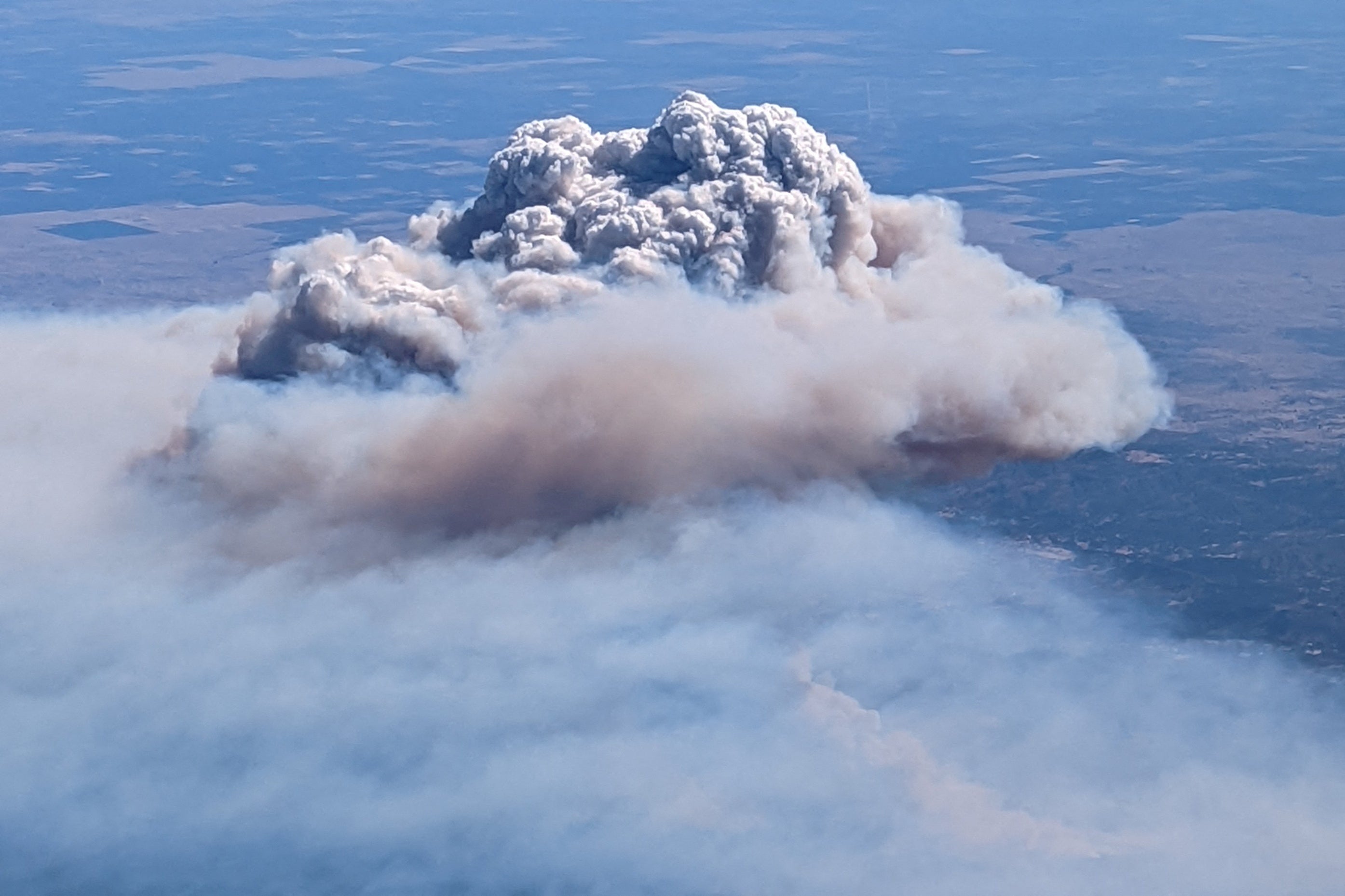 An aerial view of the Oak Fire near Yosemite National Park shows smoke from the blaze above Yosemite Valley, California.