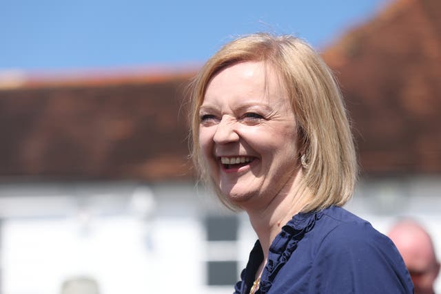 <p>Liz Truss speaks to supporters during a visit to Ashley House, Marden, Kent (James Manning/PA)</p>
