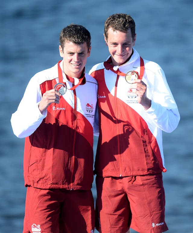 England’s Alistair Brownlee (right) celebrates with his gold medal after winning the men’s triathlon with brother Jonathan who took silver. (Martin Rickett/PA)
