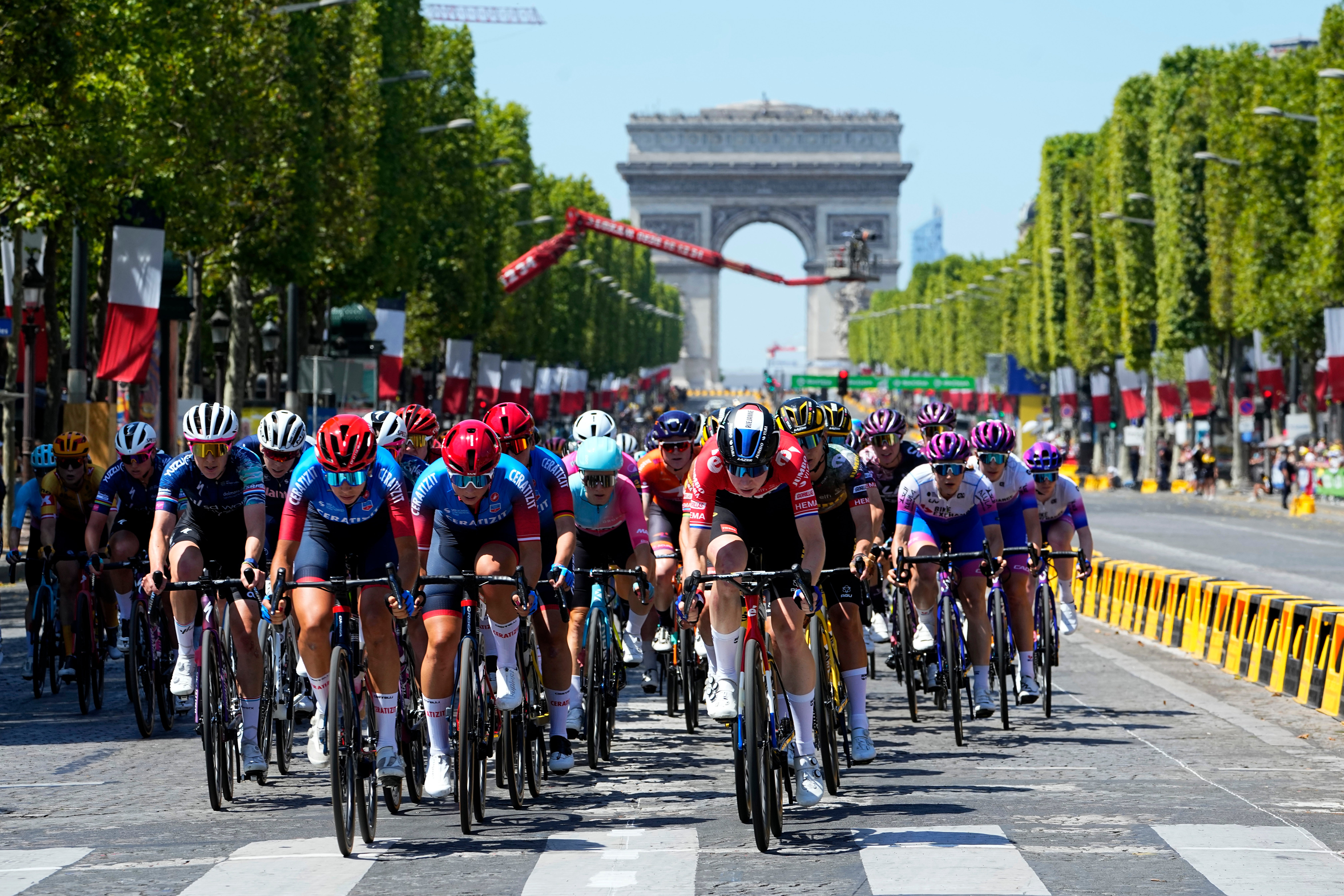 The pack speeds down the Champs Elysee