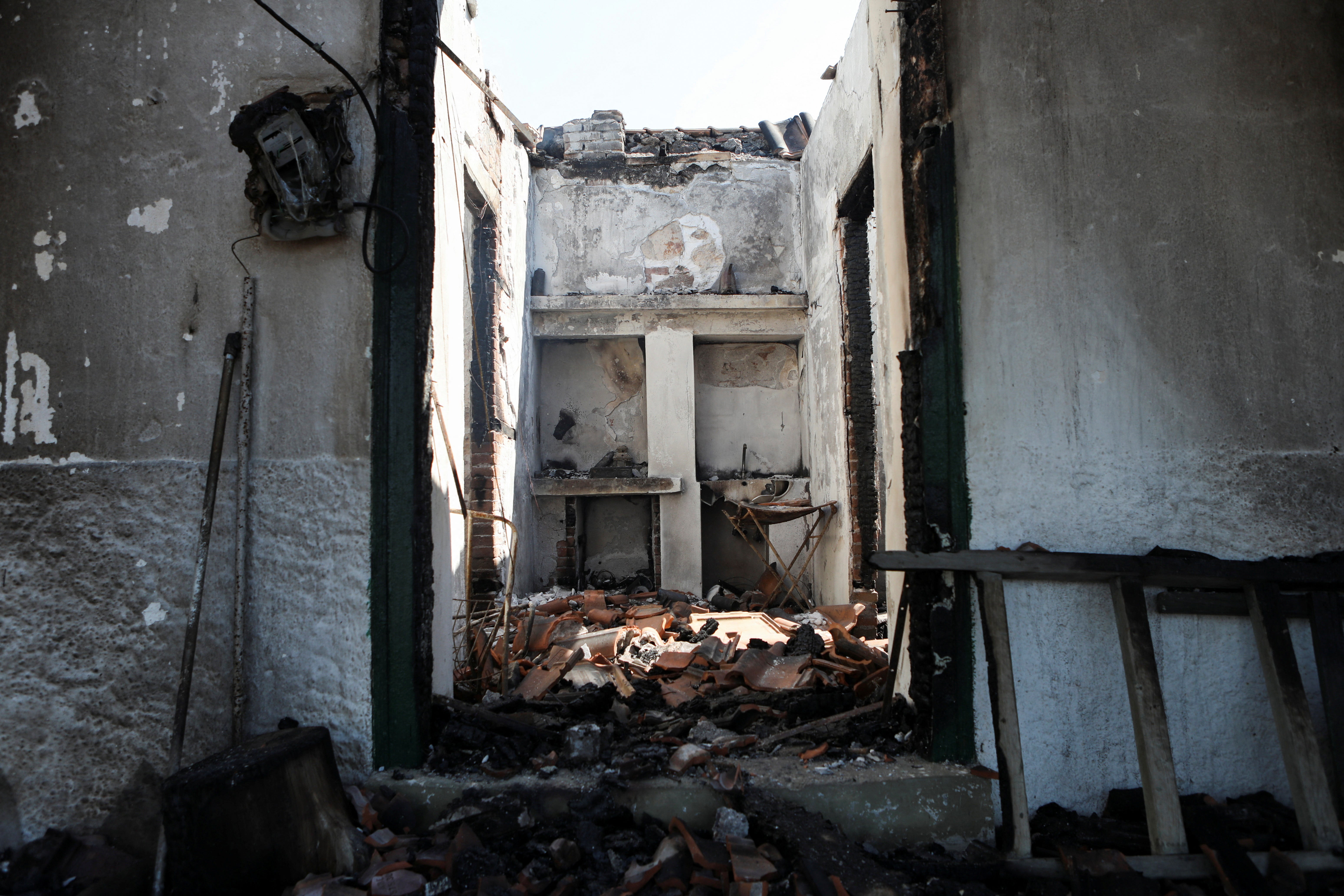 View of the interior of a burnt house on the Aegean island of Lesbos
