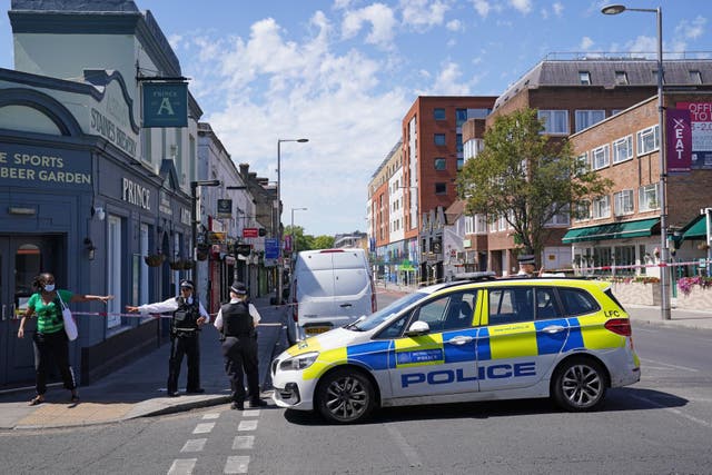 <p>Police at scene of killing on Uxbridge Road, Ealing</p>
