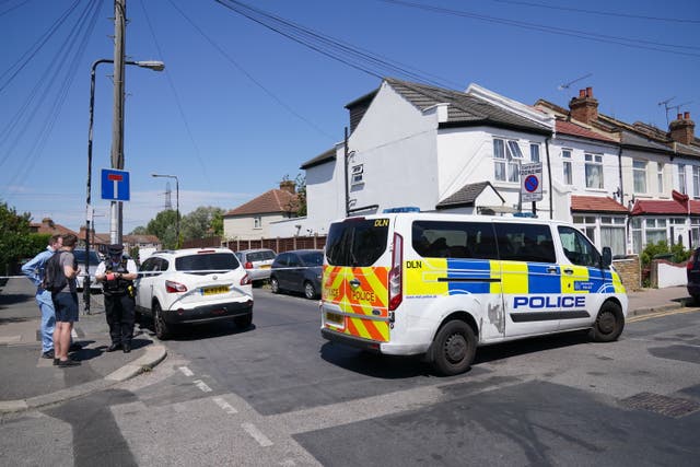 Police near the scene in Waltham Forest in east London after a 28-year-old man died after a shooting at a gathering (Jonathan Brady/PA)