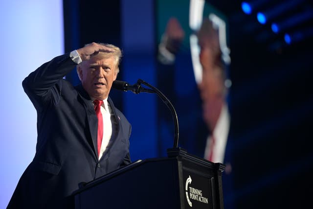<p>Former President Donald Trump looks to the crowd while addressing attendees during the Turning Point USA Student Action Summit</p>