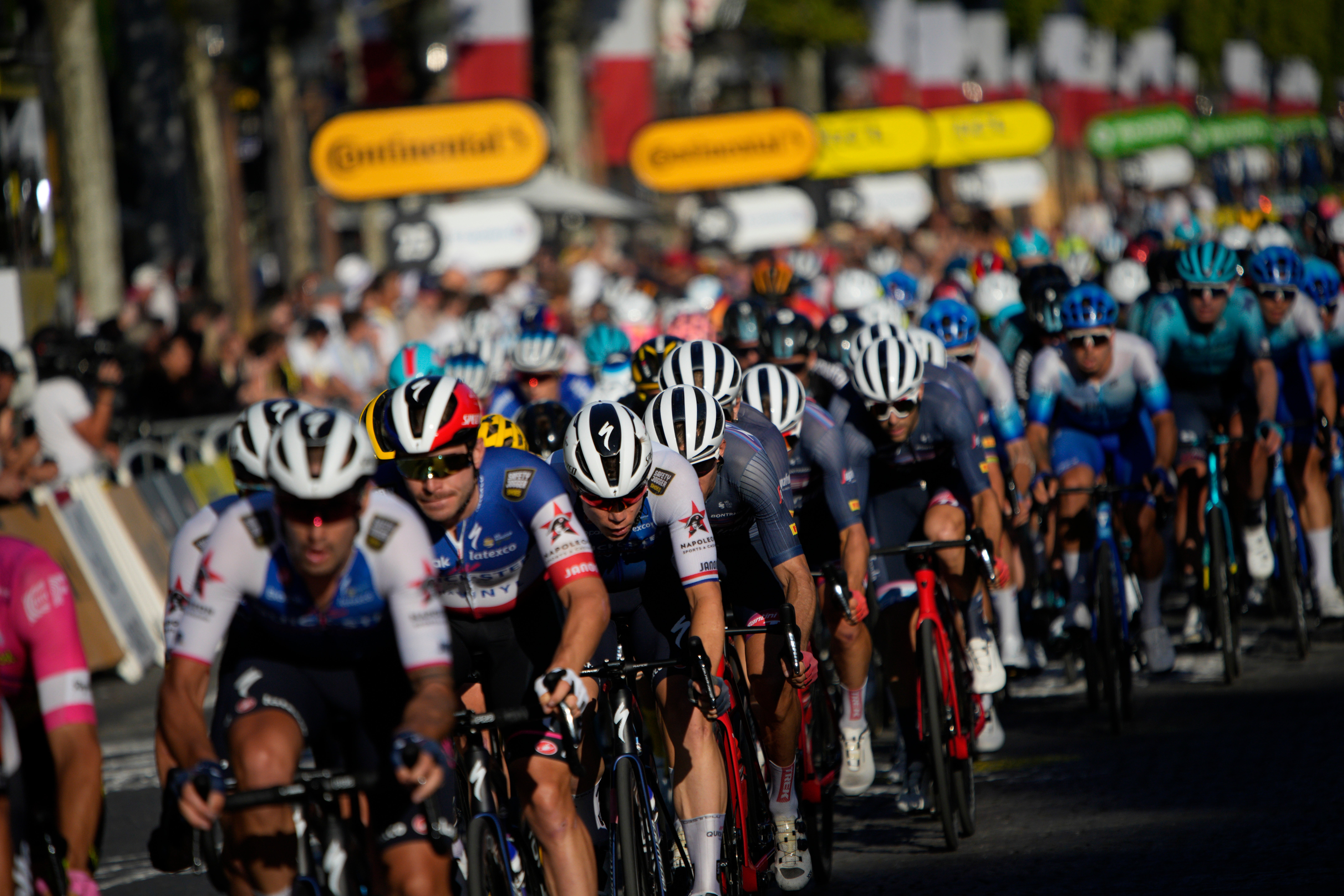 The pack rides during the twenty-first stage of the Tour de France