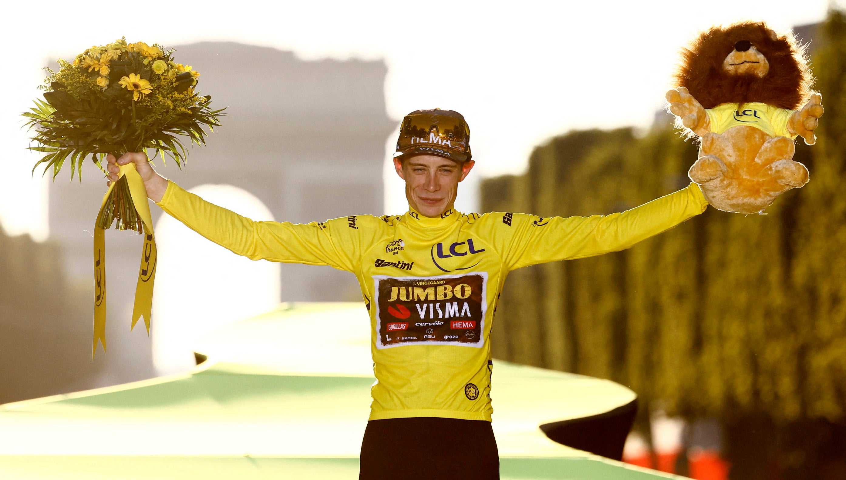 Jumbo-Visma’s Jonas Vingegaard celebrates on the podium